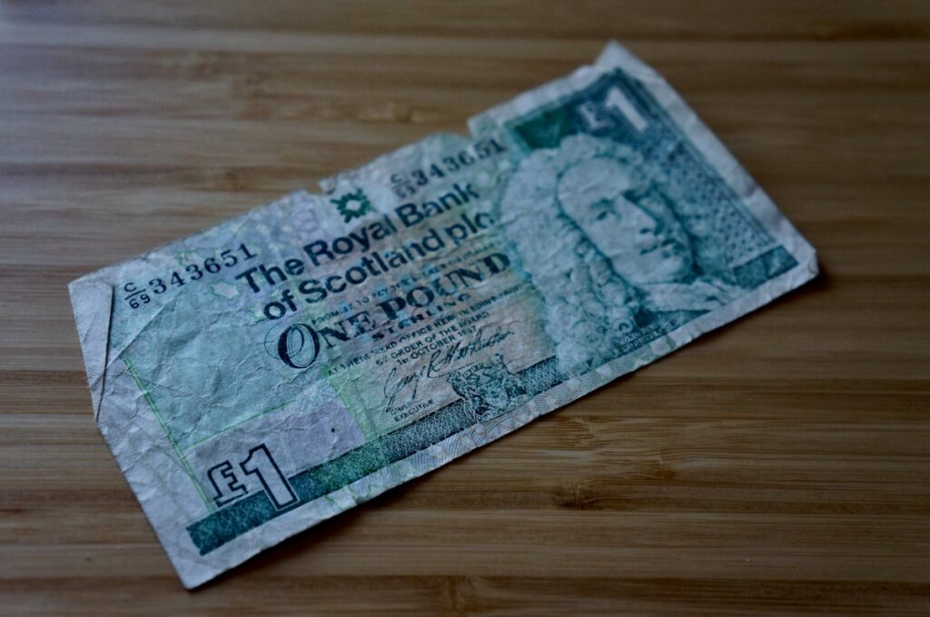 British pound banknote representing hidden fees and charges