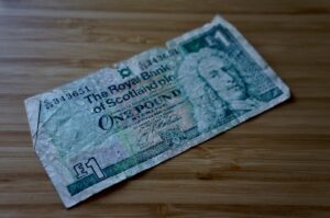 British pound banknote representing hidden fees and charges