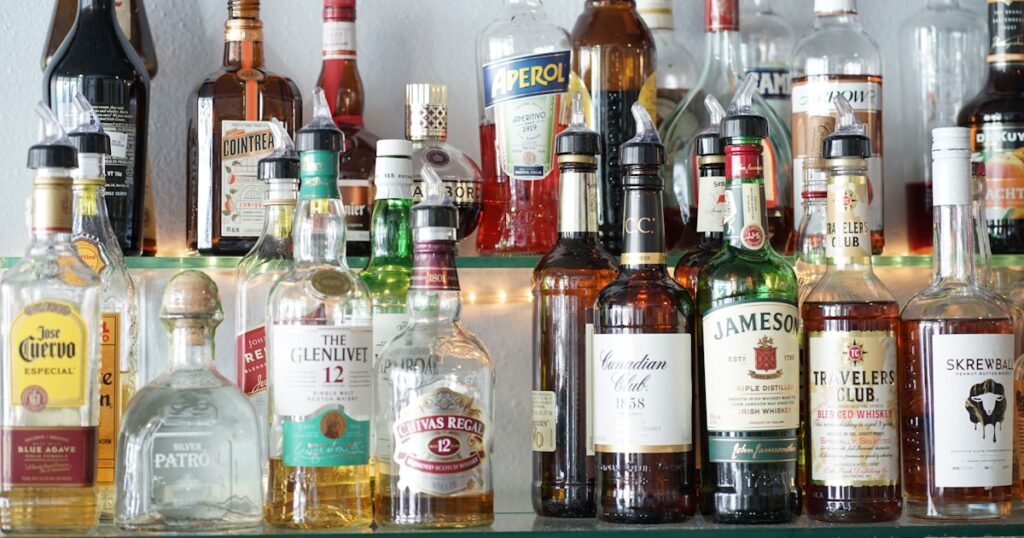 Bar with alcohol bottles representing pub overserving claims in the UK