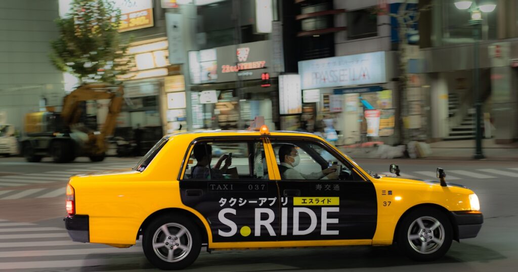 Taxi cab on city street representing rideshare accident claims in the UK