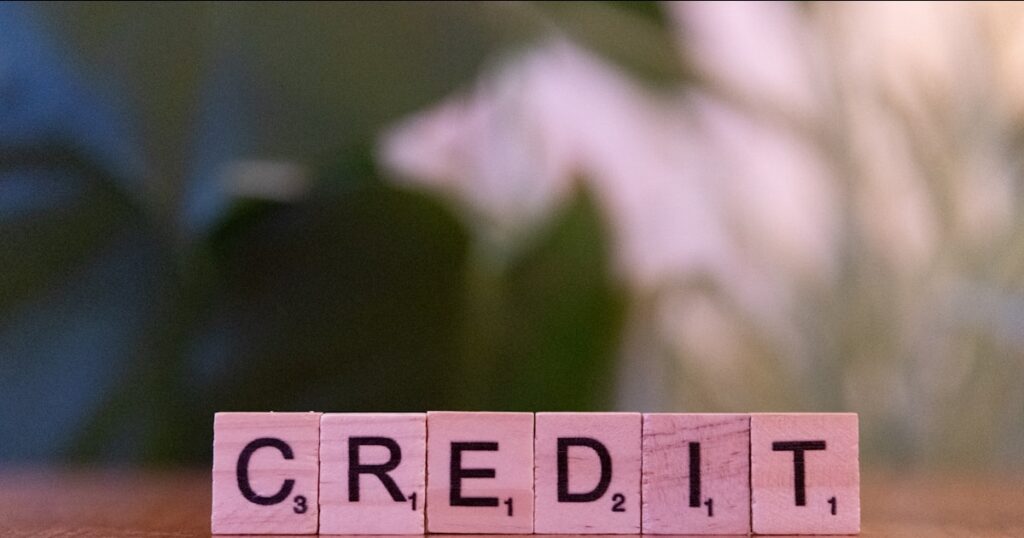 Wooden blocks spelling credit representing credit report error claims in the UK