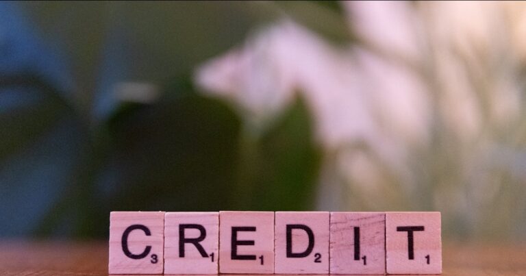 Wooden blocks spelling credit representing credit report error claims in the UK