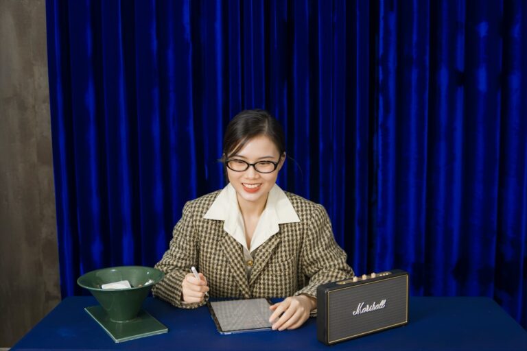 Professional at desk with laptop considering job applications