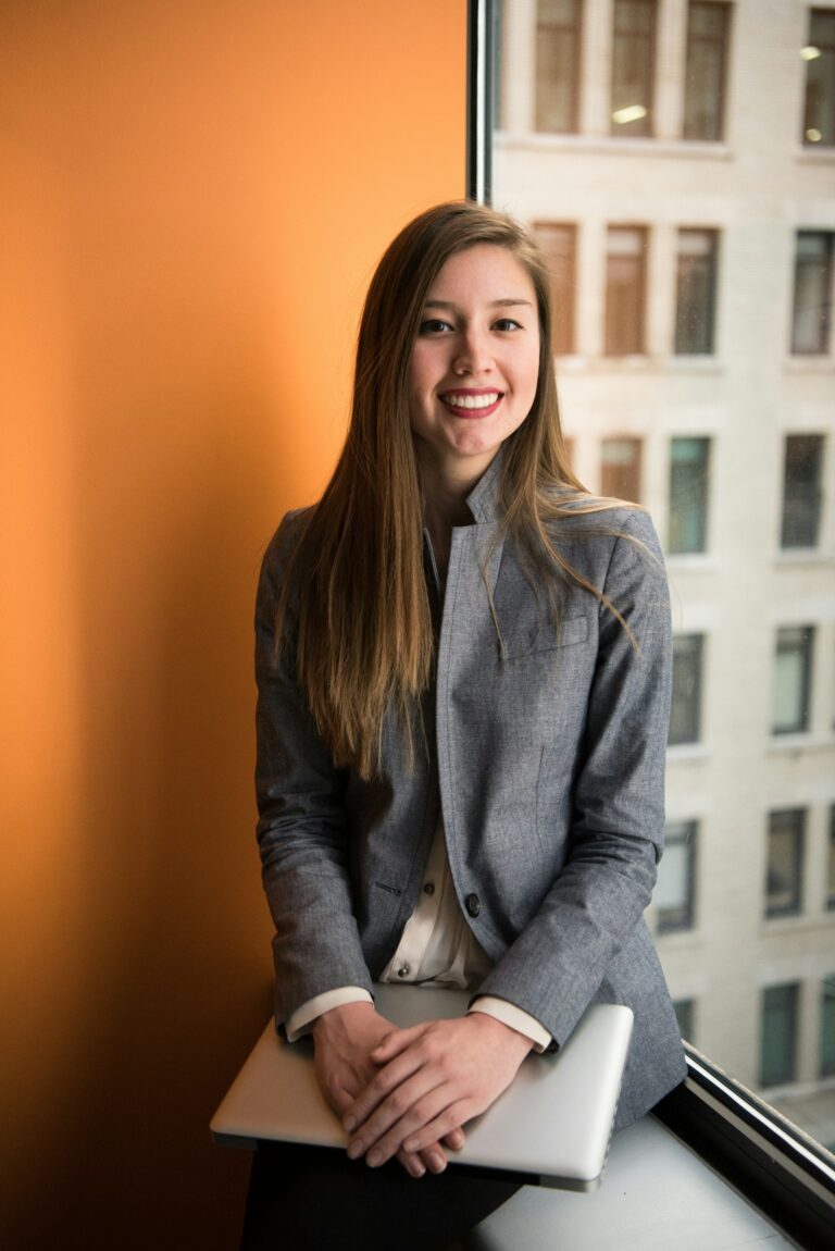 Professional woman working in an office, representing workplace pay equity discussions