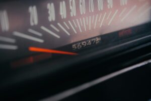 Close-up of a car speedometer and odometer display