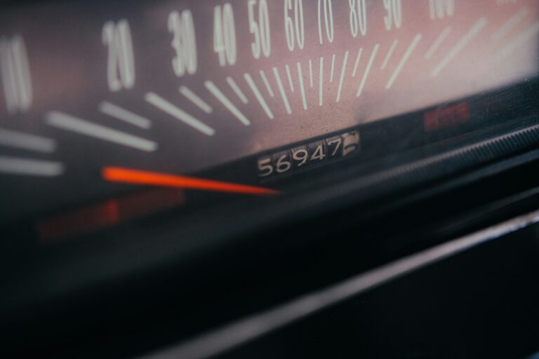 Close-up of a car speedometer and odometer display
