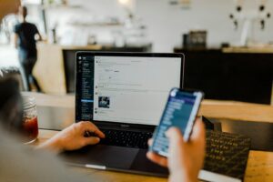 iPhone beside consumer claim documents
