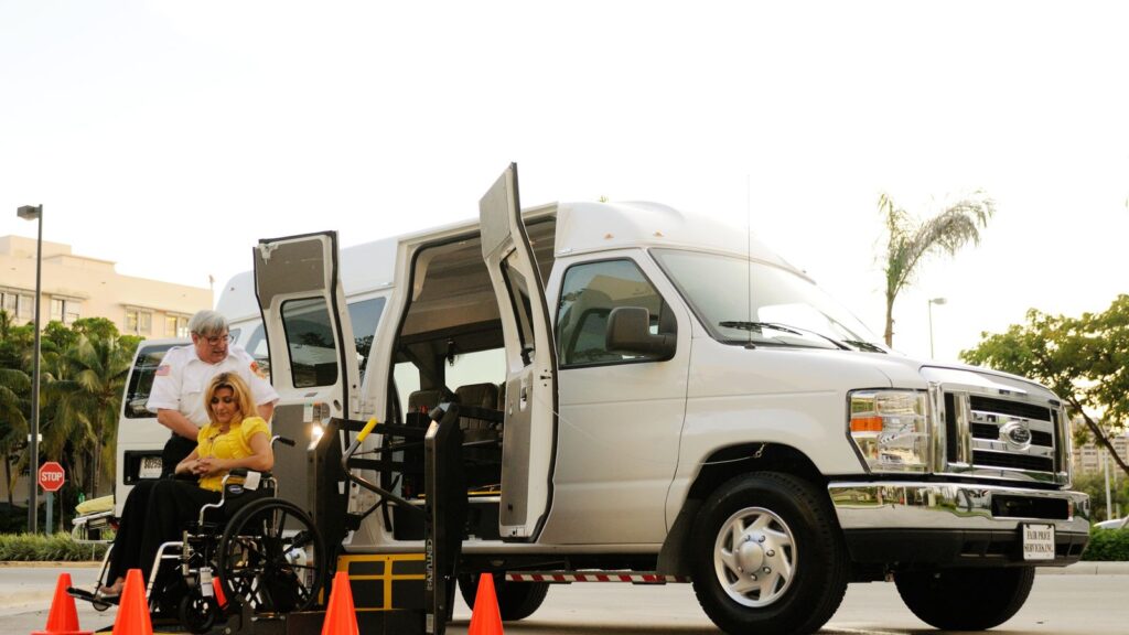 Person using wheelchair with a vehicle ramp