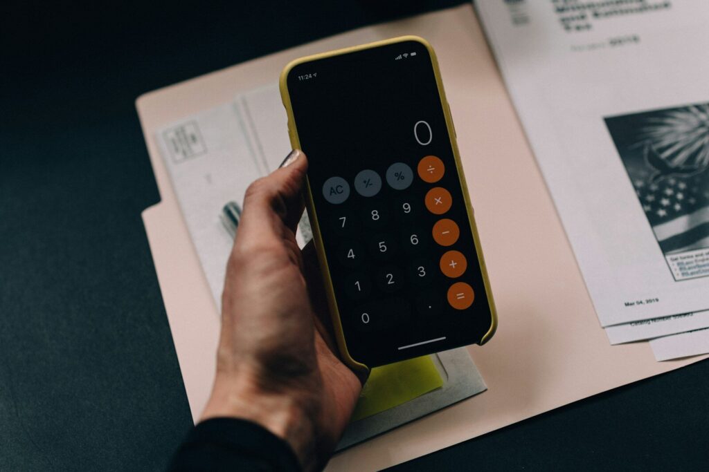 Documents and calculator representing a credit report dispute