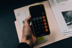 Documents and calculator representing a credit report dispute