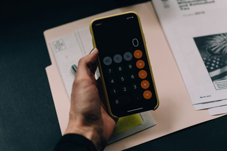 Documents and calculator representing a credit report dispute