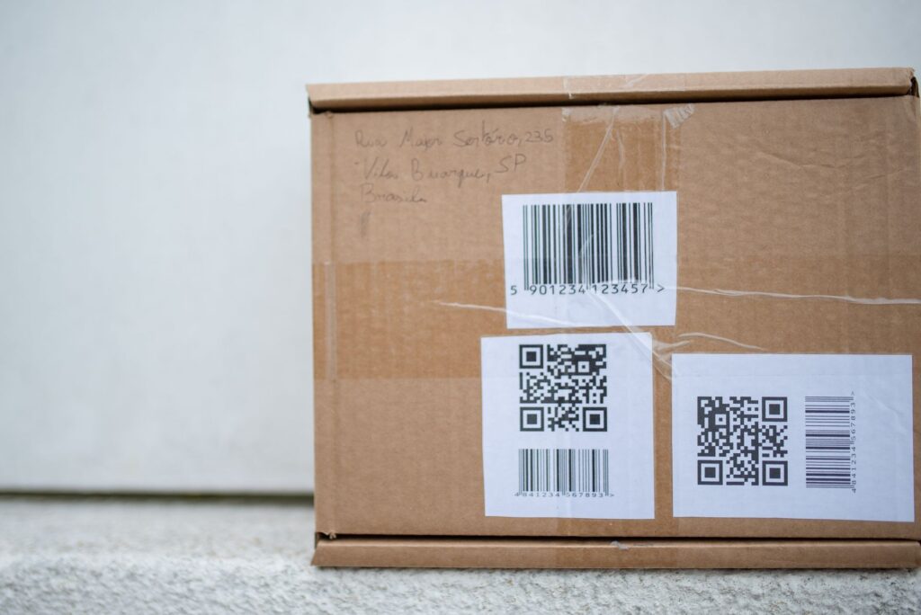 Close-up of a cardboard delivery package with shipping labels