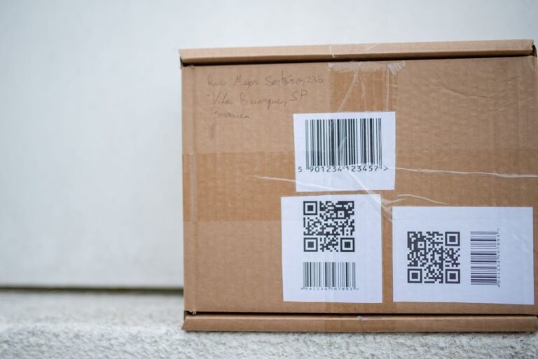 Close-up of a cardboard delivery package with shipping labels